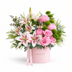 Lily Meadow main view, pink lilies, blush roses, pink chrysanthemums and green carnations in a light pink Rosarium box
