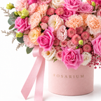 Sugar-Hearted floral detail, pink roses, blush spray roses, pale-pink carnations, champagne lisianthus and small chrysanthemums in a light pink Rosarium box