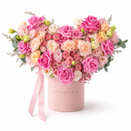 Sugar-Hearted main view, pink roses, blush spray roses, pale-pink carnations, champagne lisianthus and small chrysanthemums in a light pink Rosarium box