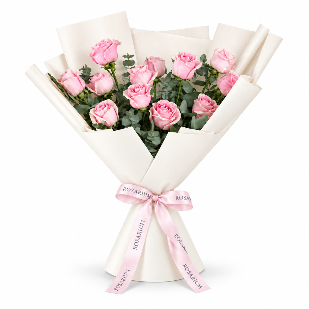 12 pink roses in off-white wrapping with a Rosarium ribbon