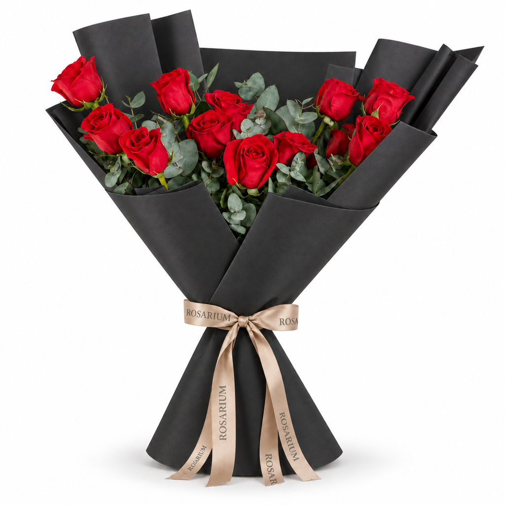12 red roses in black wrapping with a Rosarium ribbon