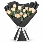 12 white roses in black wrapping with a Rosarium ribbon