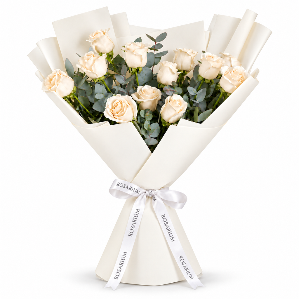 12 white roses in off-white wrapping with a Rosarium ribbon