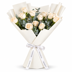 12 white roses in off-white wrapping with a Rosarium ribbon