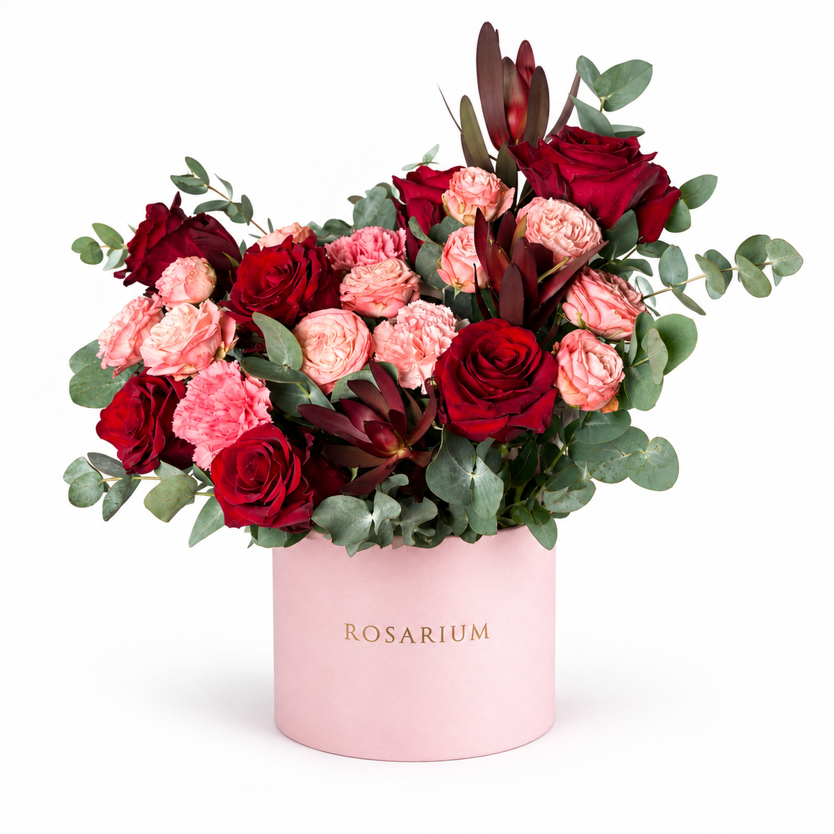 A Blush Love Note: red and pink roses with burgundy accents and eucalyptus in a light pink Rosarium flower box