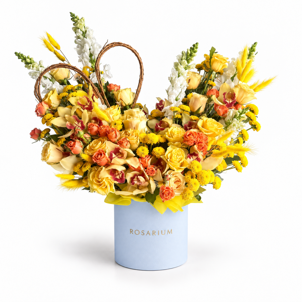 Apricot Afterglow: yellow and orange roses, yellow flowers and a woven heart in a blue Rosarium flower box