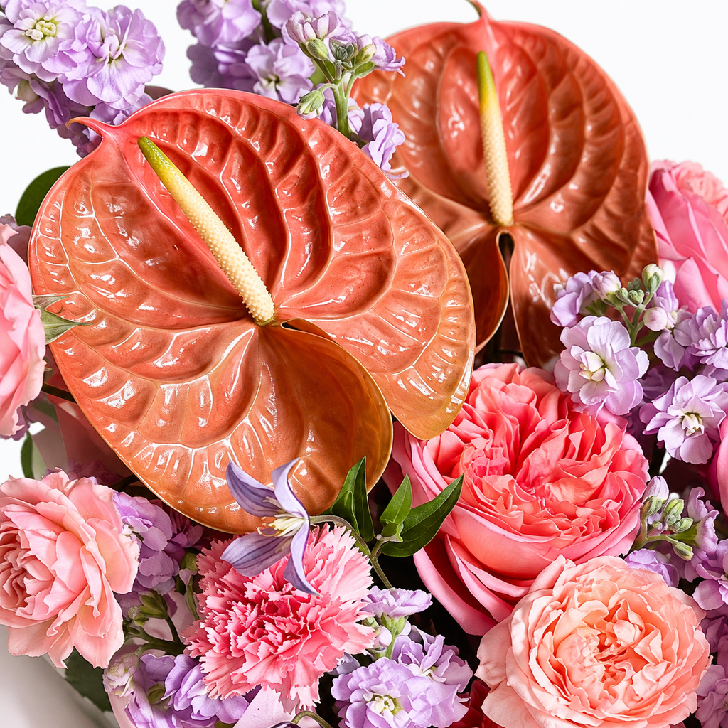 Blush After Dark: close-up of peach anthuriums, pink roses and lilac flowers