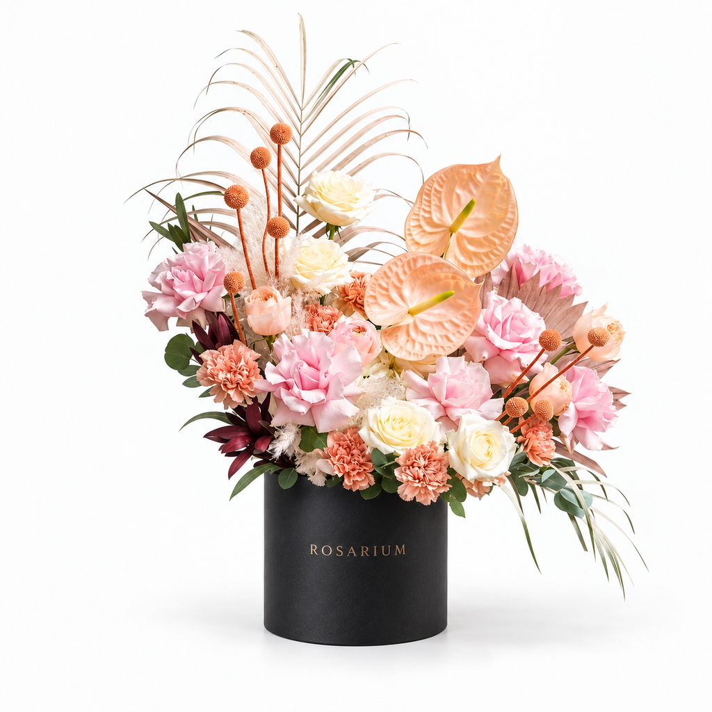 Blush, Interrupted: peach anthuriums, pink roses and small orange accents in a black Rosarium flower box
