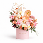 Blush, Interrupted: peach anthuriums, pink roses and small orange accents in a light pink Rosarium flower box