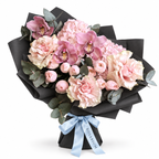Blush Spectacle: pink orchids, blush roses and pink hydrangea in black wrapping