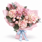 Blush Spectacle: pink orchids, blush roses and pink hydrangea in light pink wrapping
