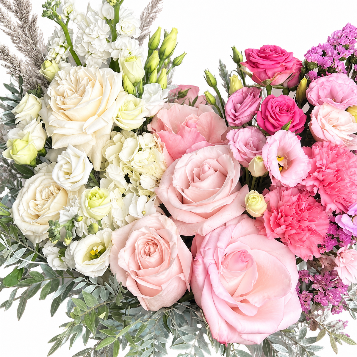 Colour Daydream: close-up of ivory and pink roses, white and pink flowers and pampas grass