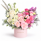 Colour Daydream: ivory and pink roses, white and pink flowers and pampas grass in a light pink Rosarium flower box