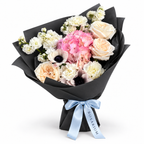 Cream with an Edge: cream roses, white anemones and pink hydrangea in black wrapping