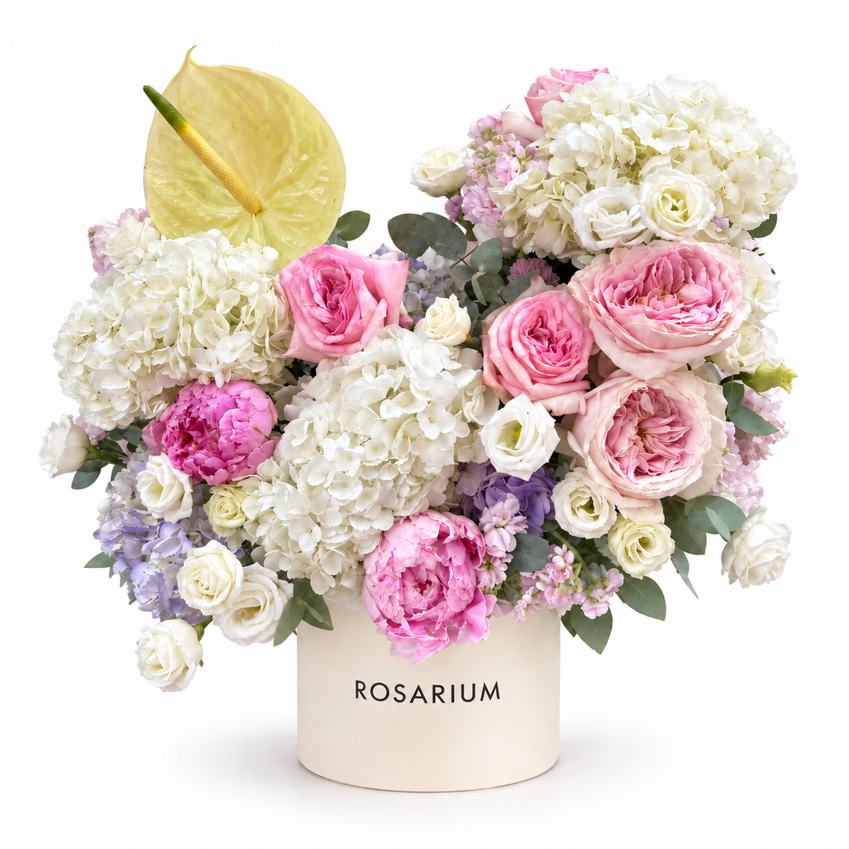 Garden Soirée — White hydrangea, pink roses and peonies with ivory spray roses, lilac accents and a pale yellow anthurium in an ivory box