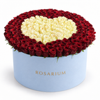 Heart in Contrast Luxe: red roses surrounding an ivory rose heart in a blue Rosarium flower box