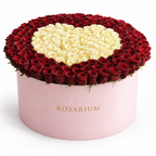 Heart in Contrast Luxe: red roses surrounding an ivory rose heart in a light pink Rosarium flower box