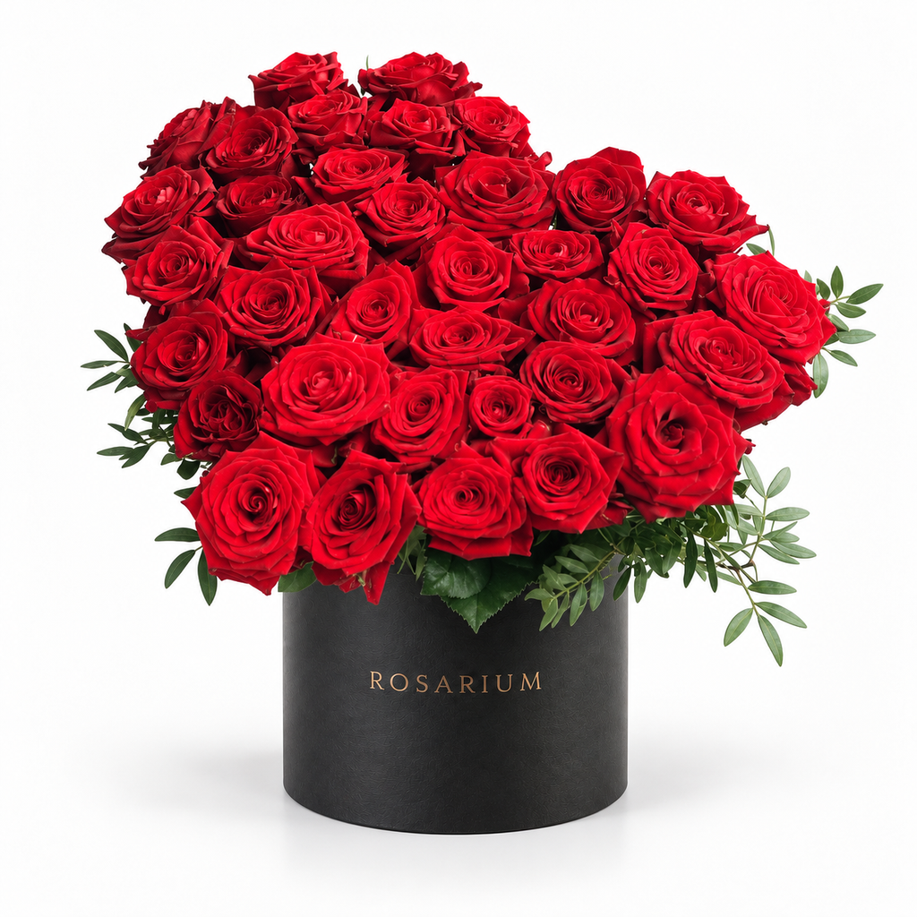Heart in Red: red roses arranged as a heart in a black Rosarium flower box