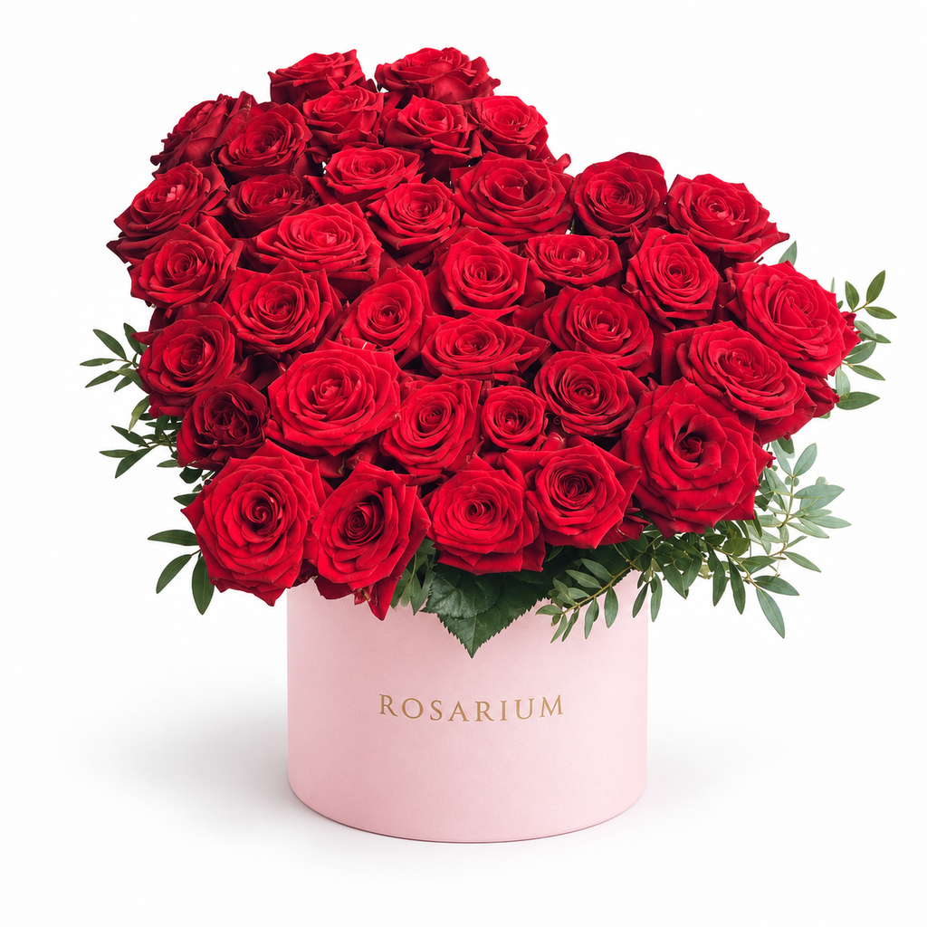 Heart in Red: red roses arranged as a heart in a light pink Rosarium flower box