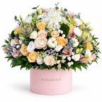Ivory & Moss: white hydrangea, cream roses, cotton and a green moss accent in a light pink Rosarium flower box