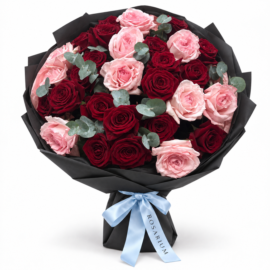 Love, Softened: red and pink roses with eucalyptus in black wrapping