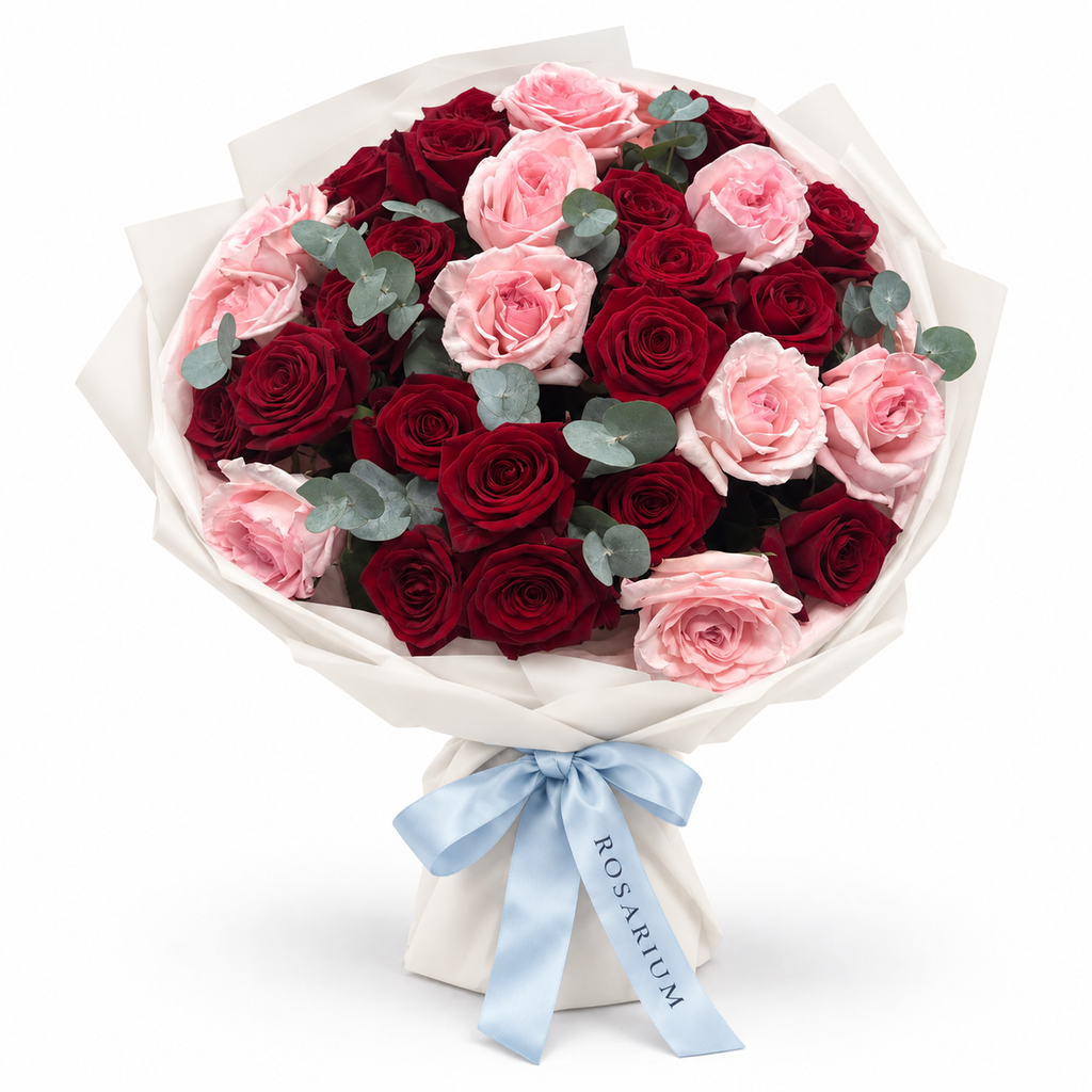 Love, Softened: red and pink roses with eucalyptus in off-white wrapping