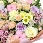 Marina in Colour: close-up of pastel roses, white orchids and small yellow flowers