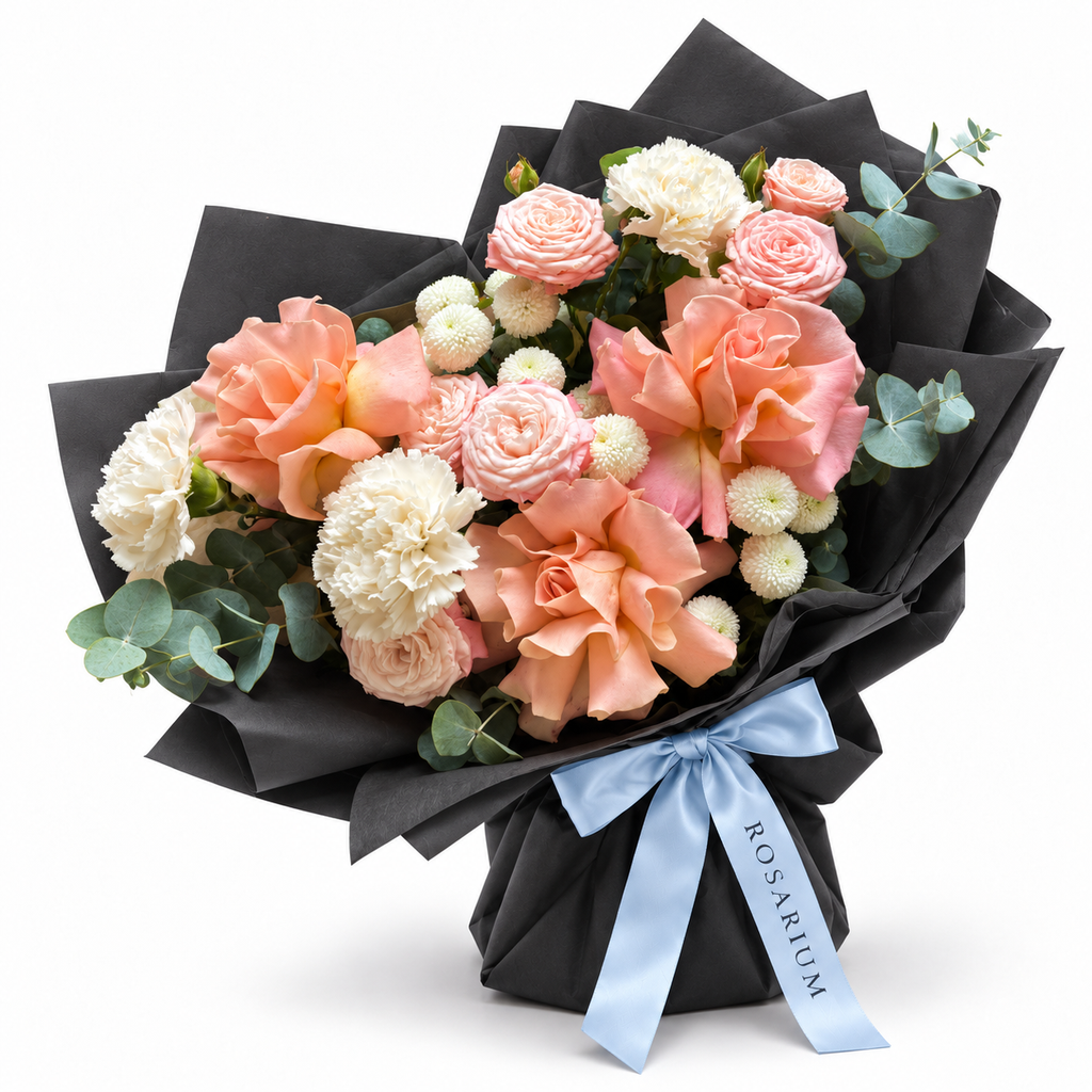 Peach in Bloom: peach roses, pink ranunculus and white flowers in black wrapping