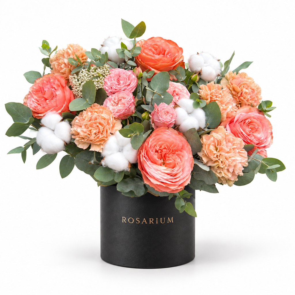 Peachy Magic: coral roses, peach carnations, cotton and eucalyptus in a black Rosarium flower box