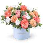 Peachy Magic: coral roses, peach carnations, cotton and eucalyptus in a blue Rosarium flower box