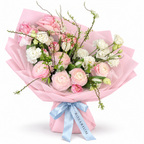 Soft-Spoken Romance: pink roses, white flowers and green branches in light pink wrapping