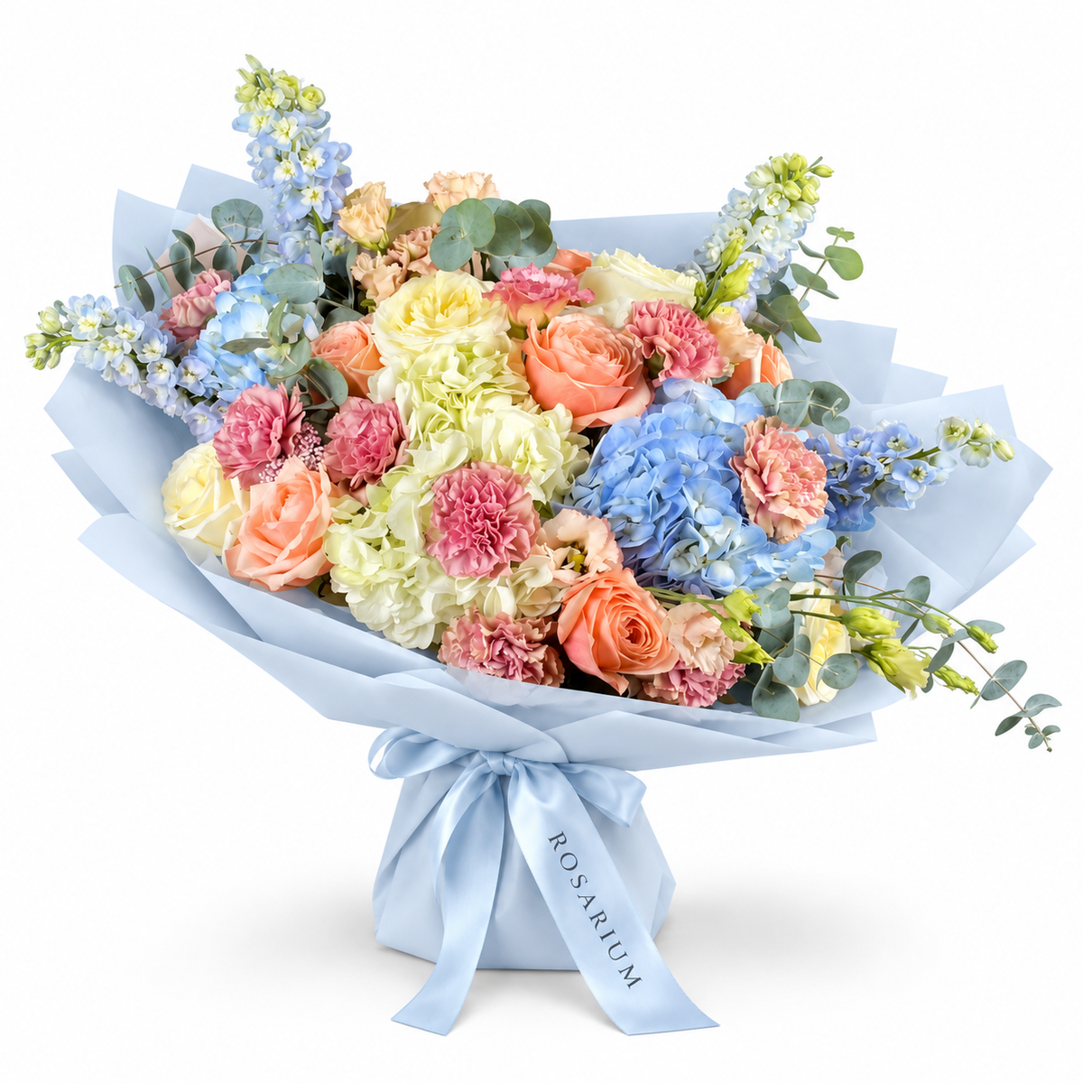 Spring with a Twist: blue and white hydrangea, peach roses and pink carnations in blue wrapping