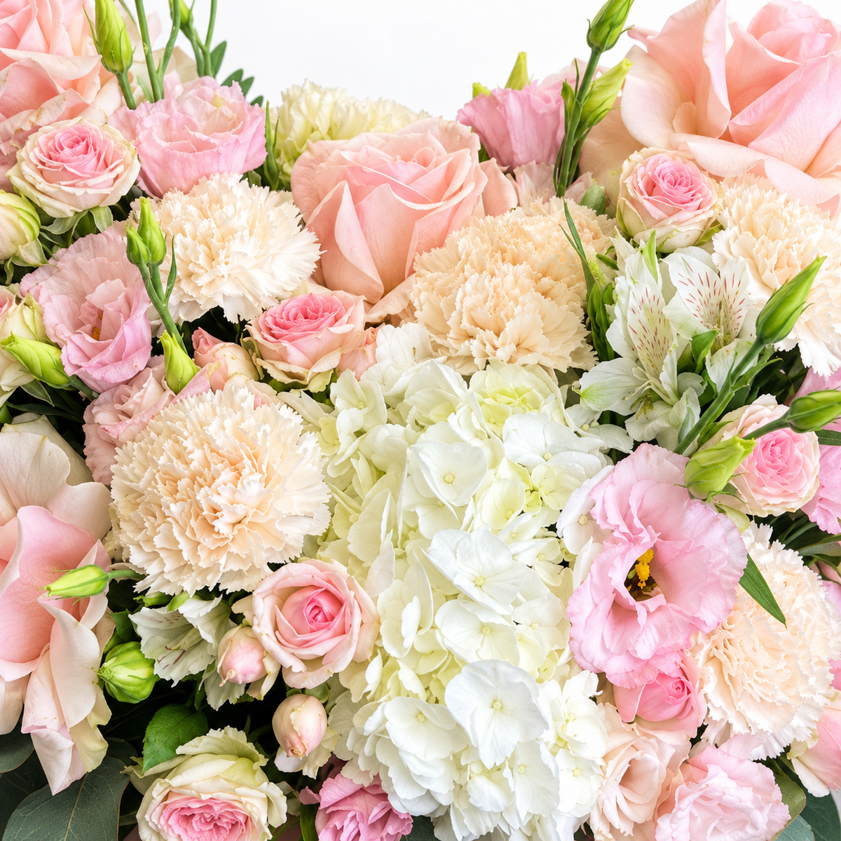 Sugar-Hearted: close-up of pink roses and cream flowers arranged as a heart