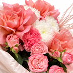 Tuscan Afterglow: close-up of coral and pink roses, pink carnations and white flowers