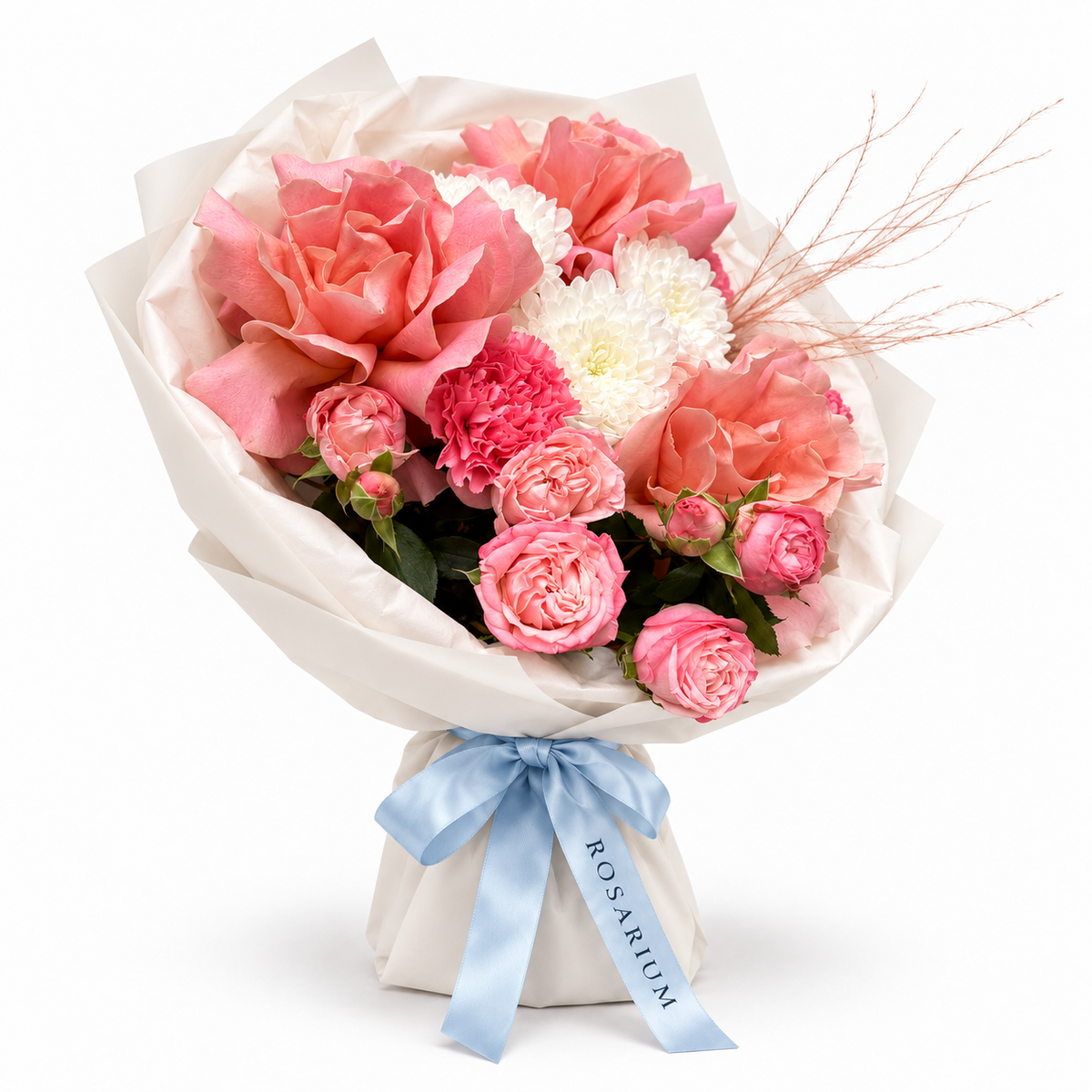 Tuscan Afterglow: coral and pink roses, pink carnations and white flowers in off-white wrapping