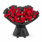 Red roses and eucalyptus in black wrapping with a Rosarium ribbon
