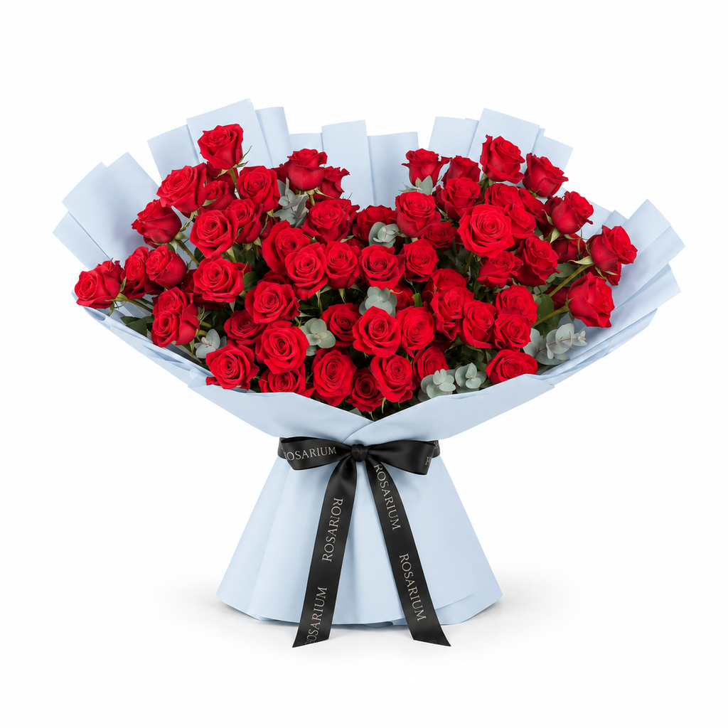 Red roses and eucalyptus in blue wrapping with a Rosarium ribbon