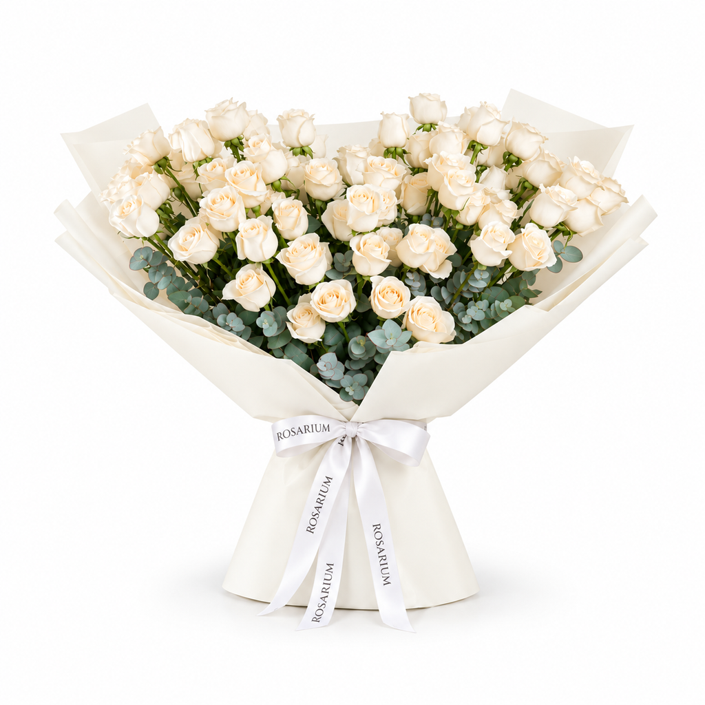 White roses and eucalyptus in off-white wrapping with a Rosarium ribbon