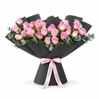 Wide bouquet of pink roses and eucalyptus in black wrapping with a Rosarium ribbon