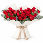 Wide bouquet of red roses and eucalyptus in off-white wrapping with a Rosarium ribbon