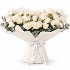 Wide bouquet of white roses and eucalyptus in off-white wrapping with a Rosarium ribbon